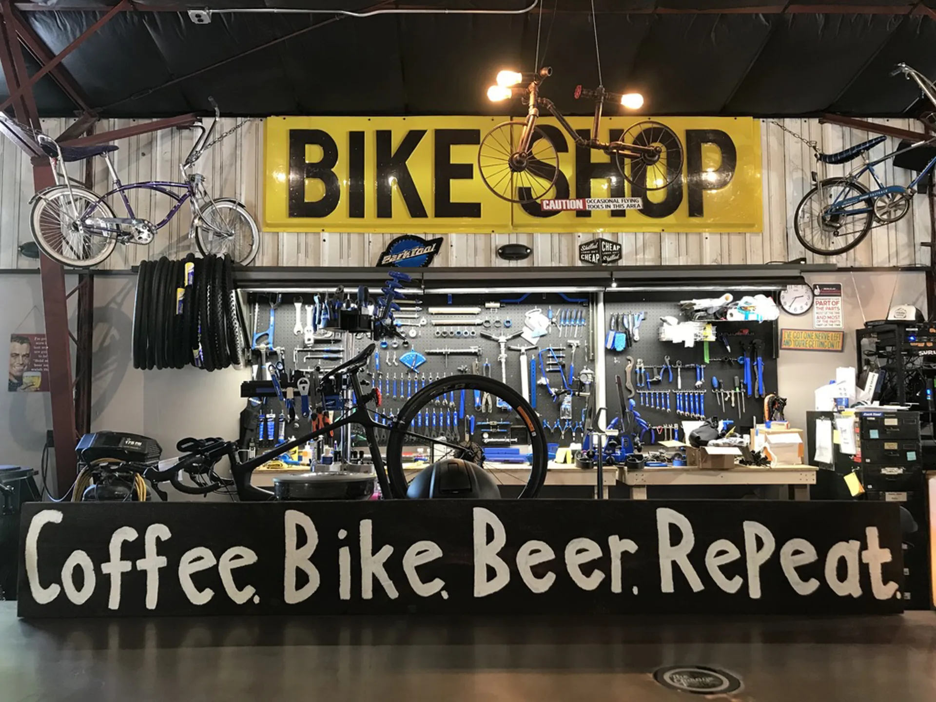 Bike Shop with Coffee Bike Beer Repeat sign