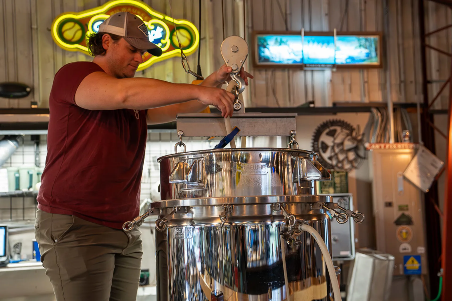 Brewer working the brew kettle