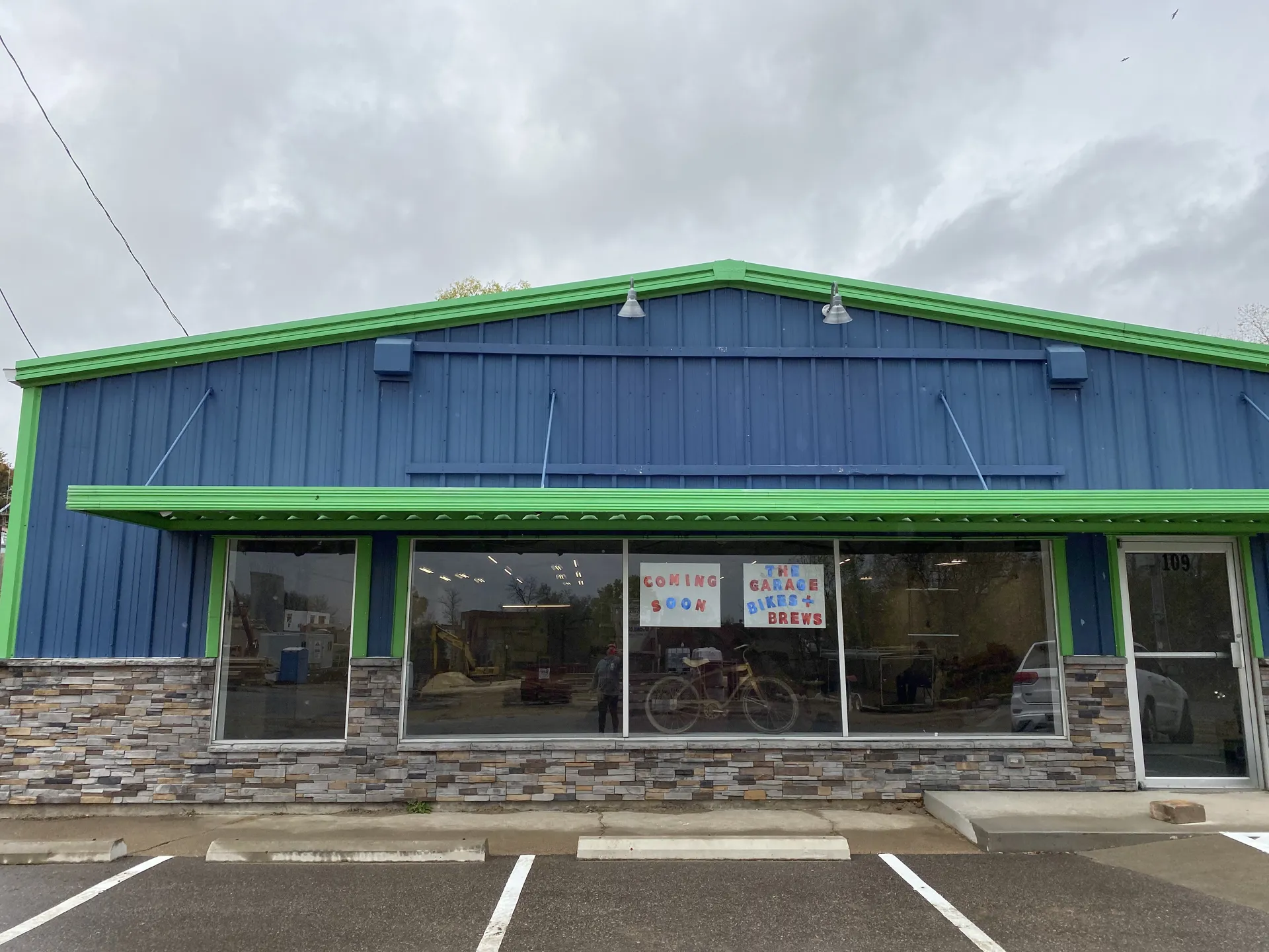 Exterior of The Garage with Coming Soon sign in the window